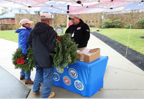 Vet Center staff speak with volunteers at Wreaths Across America